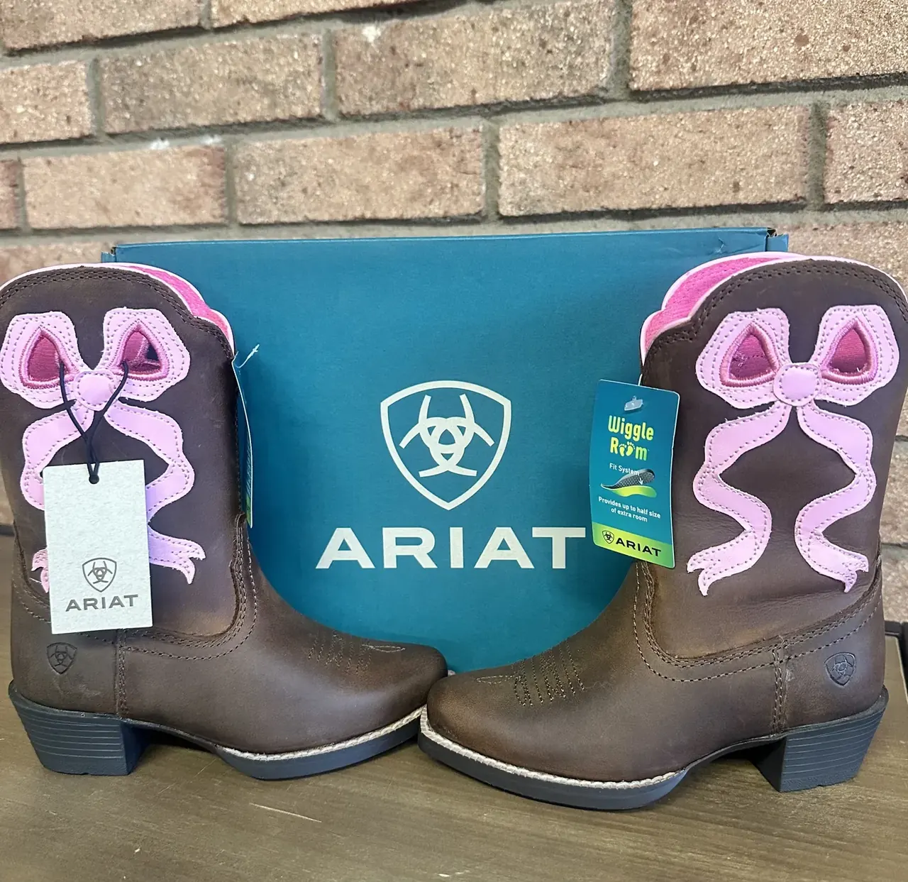 Kids' pink Ariat cowgirl boots with Ariat box