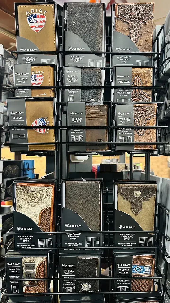 Ariat rodeo wallets, tri-folds and checkbook covers on display in store